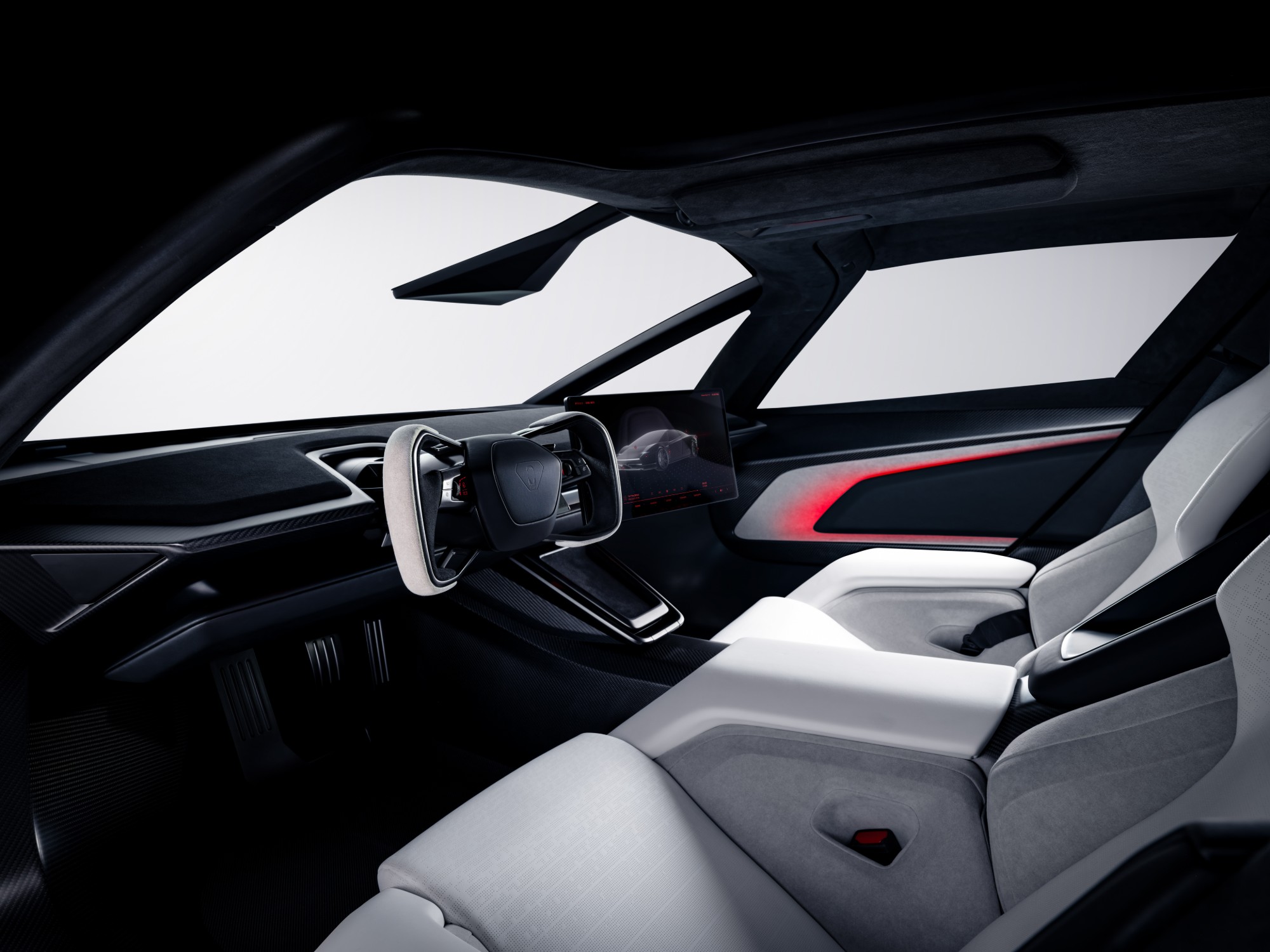 The Roadster’s cockpit with a steering yoke, a central touchscreen and white sports seats